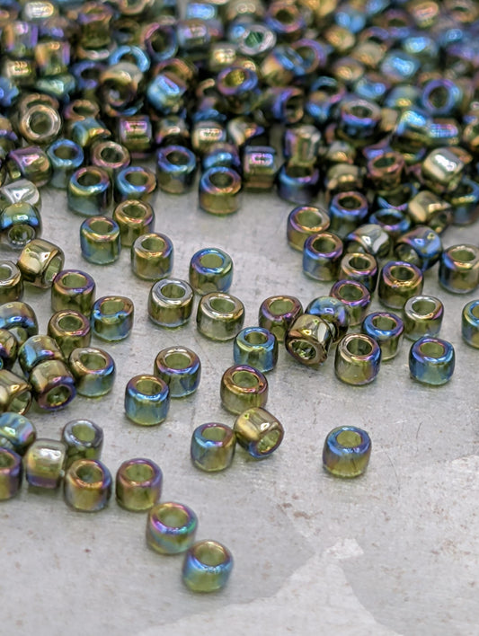 a collection of small, colorful beads scattered on a surface.