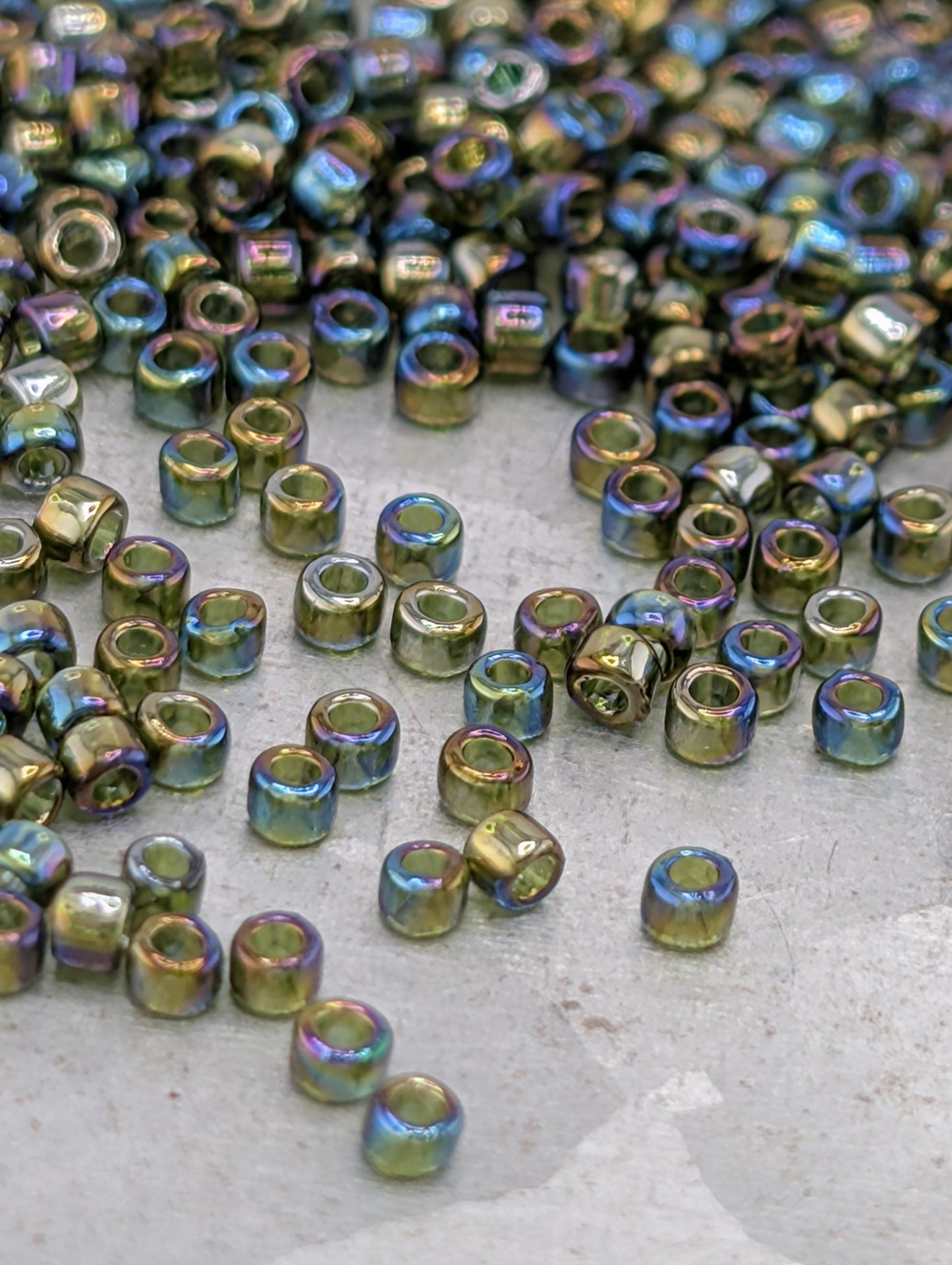 a collection of small, colorful beads scattered on a surface.