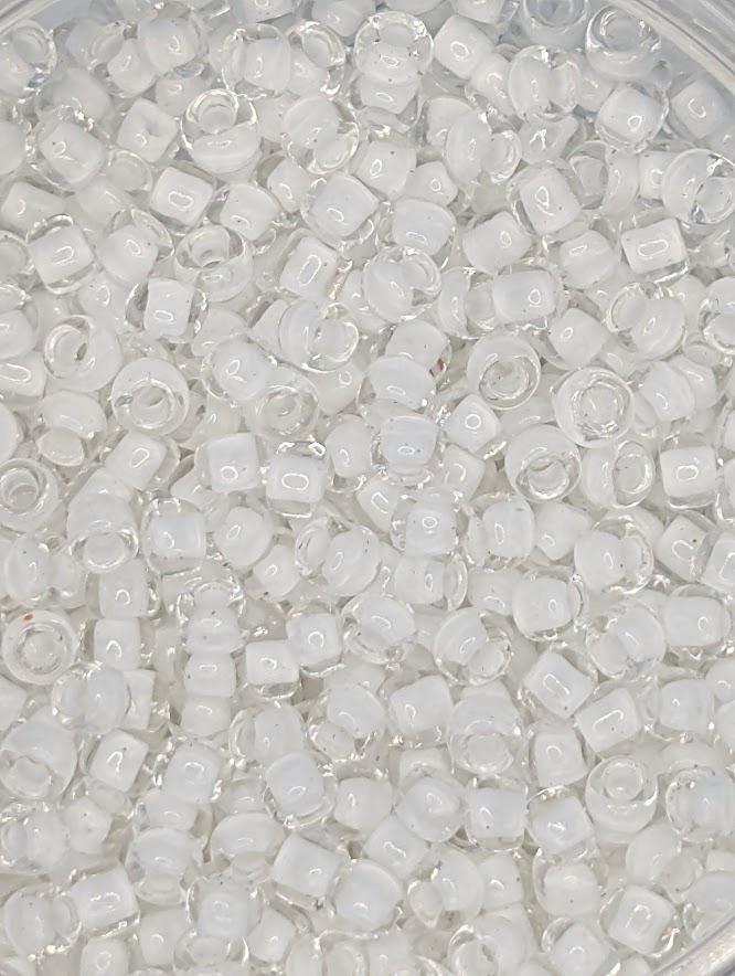 numerous small, clear beads or glass beads scattered throughout the frame.