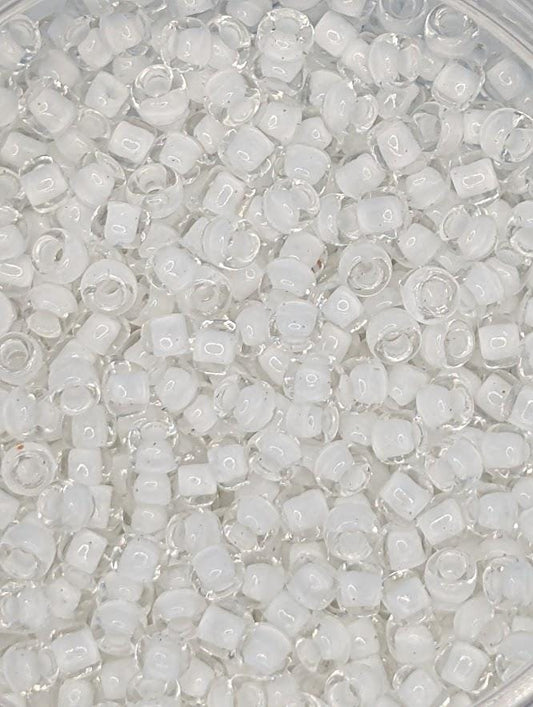 numerous small, clear beads or glass beads scattered throughout the frame.