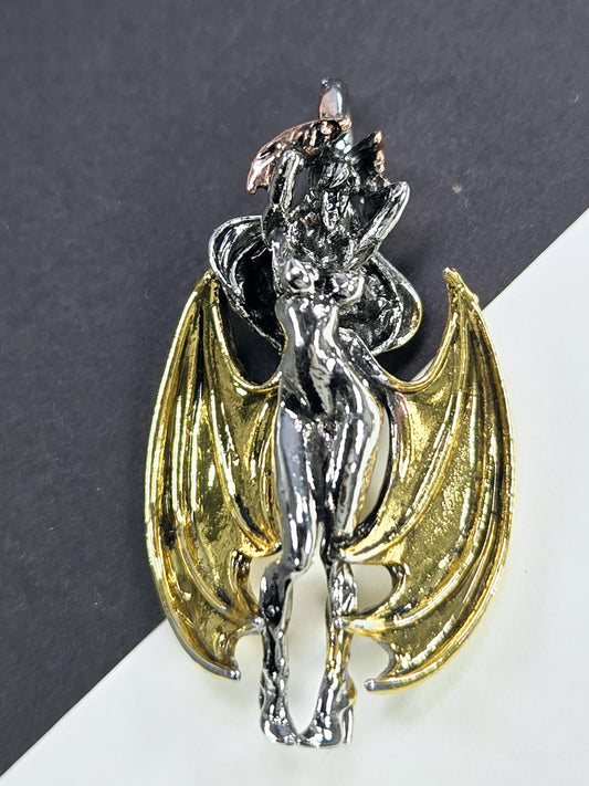 A metallic, winged figure resembling a bat or dragon, with a shiny, golden-colored body and wings.