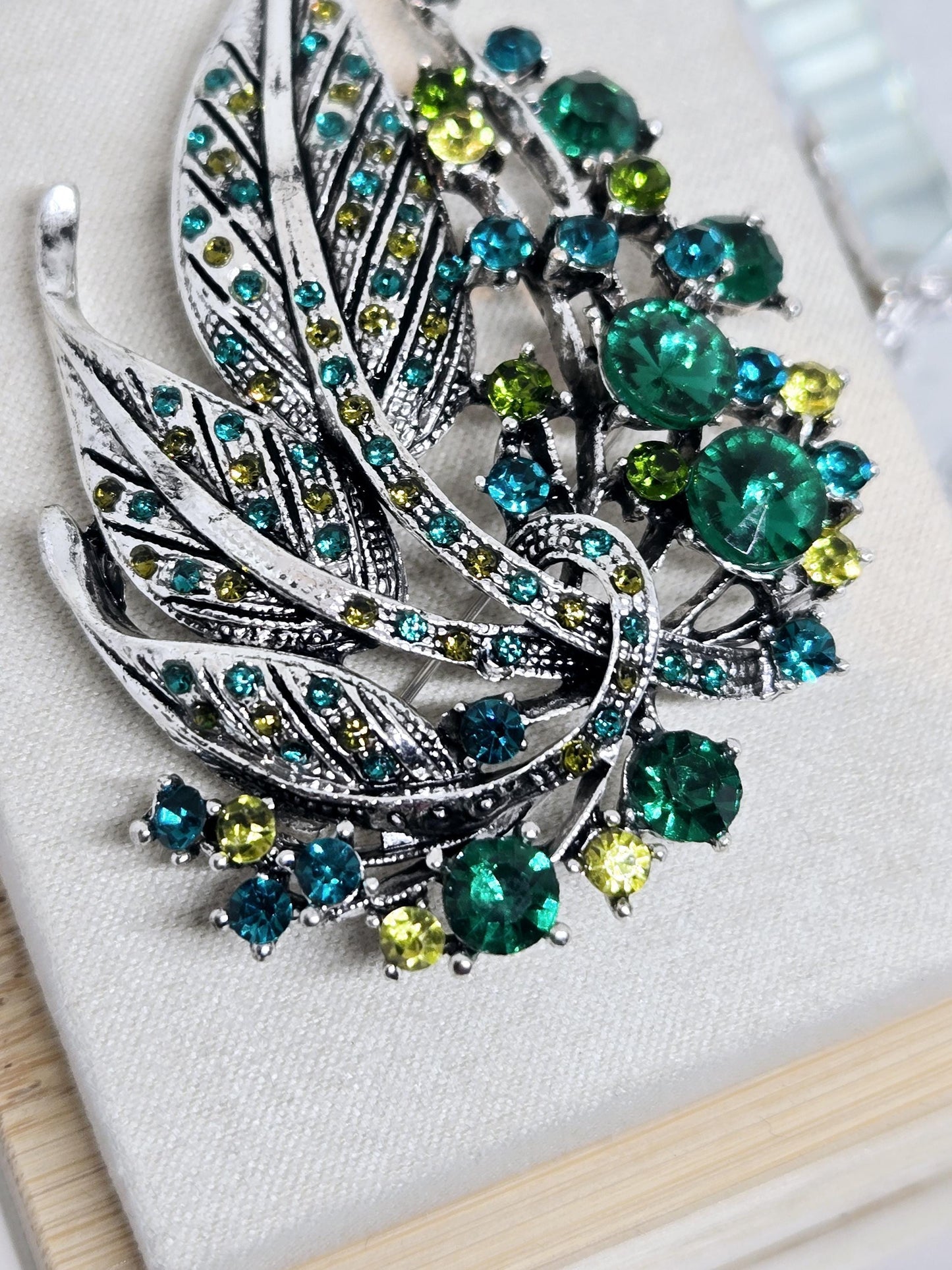 Silver Plated Brooch - Green Feather Decorative Pin With Blue Topaz & Emerald Accents