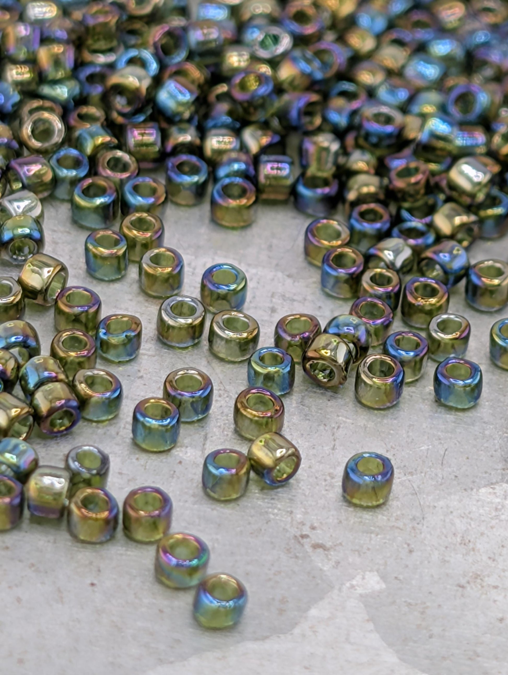 a collection of small, colorful beads scattered on a surface.