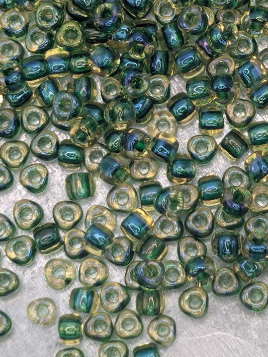 a collection of small, colorful beads scattered across a surface.